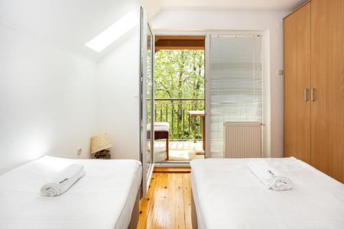 Ένα ή περισσότερα κρεβάτια σε δωμάτιο στο Villa Hills Sarajevo