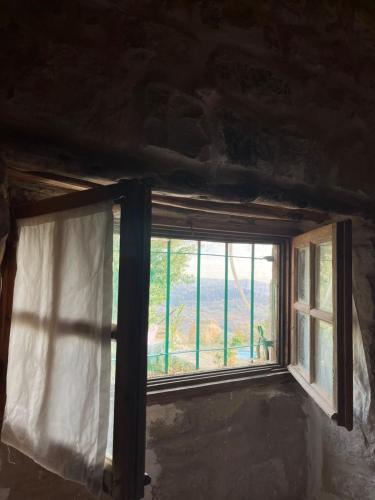 a window in a room with a view at Hartna zaman in Taiyiba