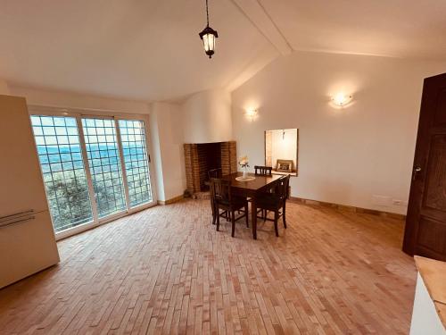 an empty living room with a table and chairs at Il Casaletto in Palombara Sabina