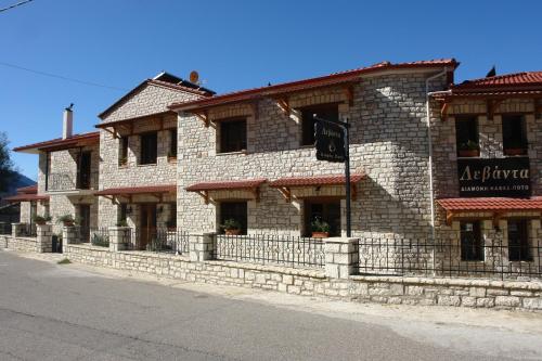 a large brick building on the side of a street at Levanta in Méga Khoríon