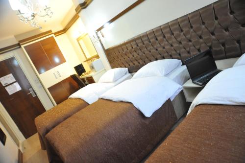 Gloria Tibi Hotelにあるベッド