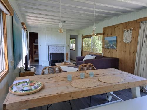 a large wooden table in a living room at Zeeuwse Landhoeve Chalet in Brouwershaven