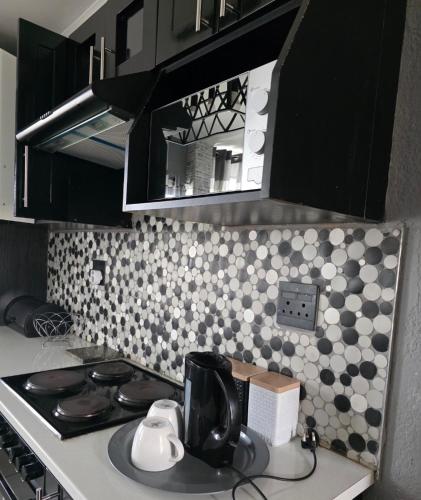 Una cocina o cocineta en Elite Escape