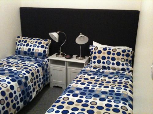Ein Bett oder Betten in einem Zimmer der Unterkunft Adelaide - Semaphore Beach Front