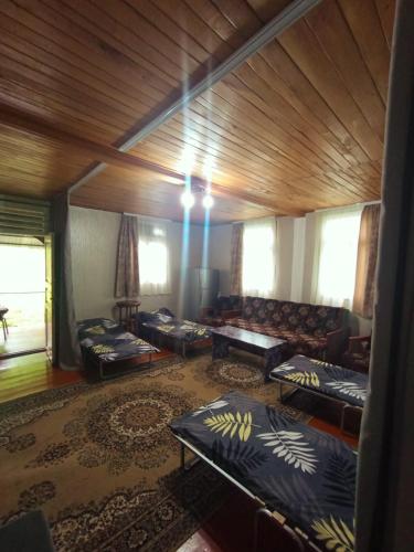 a room with beds and a couch in a room at Guest house VL in Alaverdi