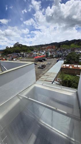 a view of a balcony with a view of a city at Hotel Imperial in Chiquinquirá