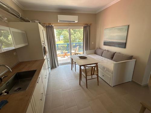 a living room with a couch and a table at Katalyma Thalassa in Ixia