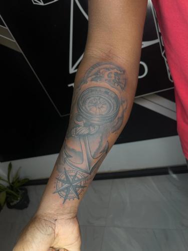 a person with a tattoo on their arm at Dream Tattoos in Weligama