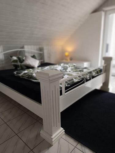 a room with a bed with a stove in it at 65 qm Ferienwohnung im Grünen in Albbruck
