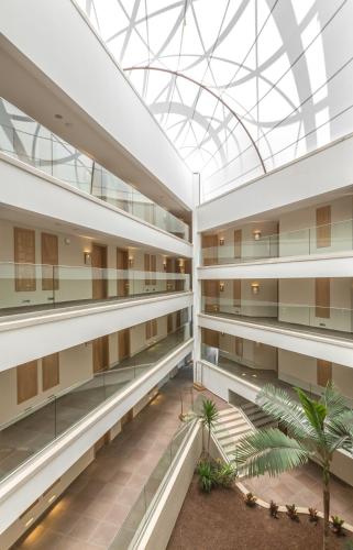 an interior view of a building with a glass ceiling at Boyalik Beach Hotel & Spa Cesme in Cesme