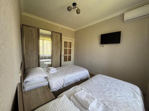 Ένα ή περισσότερα κρεβάτια σε δωμάτιο στο Rockside House Areni