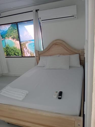Postel nebo postele na pokoji v ubytování CABAÑAS CALIPSO, 2 piso