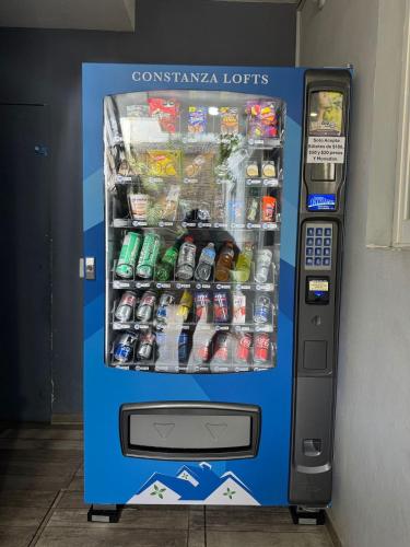 a blue vending machine filled with drinks and soda at Constanza Lofts Executives en Zapopan Jalisco in Guadalajara