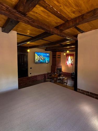 a living room with a flat screen tv on the wall at Rajkova Divana in Krepoljin