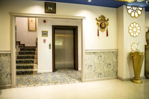 a hallway with a door in a building at Edibe Sultan Hotel in Istanbul