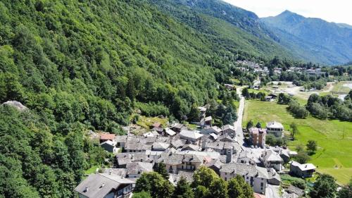 an aerial view of a village in the mountains at Casa nella valle in Groscavallo