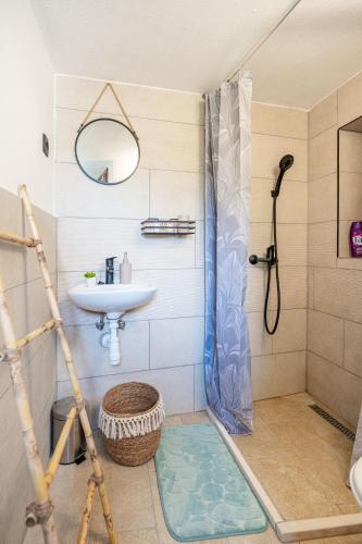 a bathroom with a shower and a sink at Meadow Hill in Žrnovo