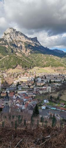 a small town in front of a mountain at Hotel&Restaurant Gasthof zur Post Eisenerz in Eisenerz