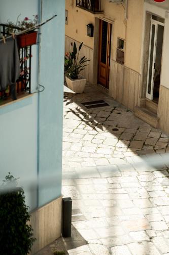 an empty alley with a building and a door at Nina Mia in Fasano