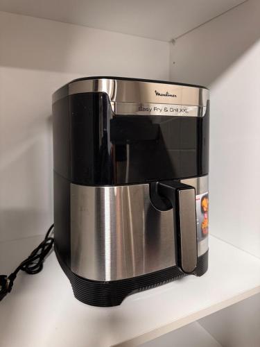 a coffee maker is sitting on a shelf at Brisa Atlántica in Ponteareas