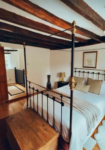 a bedroom with a bed and a wooden floor at Foundry Cottage, Duke St Norwich, City Centre in Norwich