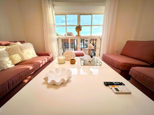 a living room with a couch and a coffee table at Cisneros Royal in La Zubia