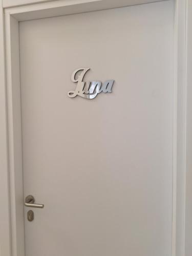 a close up of a door with a sign on it at La Stazione Sabina Alloggio Turistico in Stimigliano