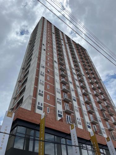 a tall building with balconies on the side of it at Céntrico apartamento zona 10 in Estación Pamplona
