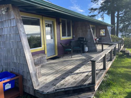 a wooden deck on a house at Seine Boat Inn in Alert Bay