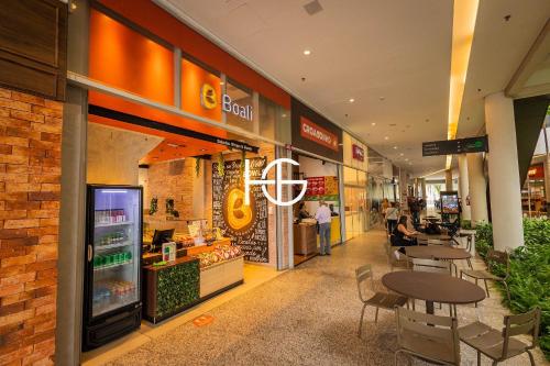 a grocery store with a table and chairs in a mall at 2206 - Studio | alto padrão in Guarulhos