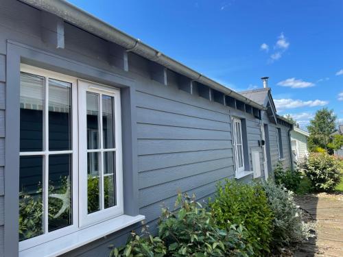 a gray house with a window on the side of it at Seafolly Beach House The Bay Filey Step Free Accommodation Private Offstreet Parking in Filey