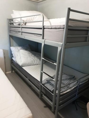 a couple of bunk beds in a room at Holiday Riverside Beach Camping in Gol