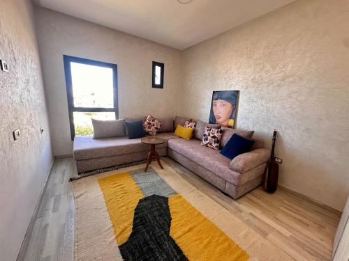 a living room with a couch and a table at Prestige apartment, Tamaris, sea view in Tamaris