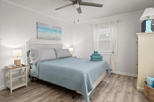 a bedroom with a bed and a ceiling fan at Ocean Whisperers, 5 min Walk to Boardwalk & Beach, Just Renovated 2025 in Ocean City