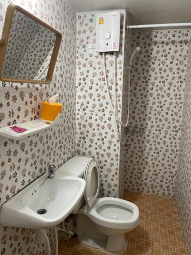 a bathroom with a toilet and a sink at Dailyroom C3,C4by Anna in Nonthaburi