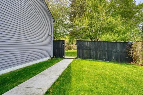 a house with a fence and a grass yard at MdPulse 2BR Upper Suite Peaceful Retreat Near DC in Waldorf