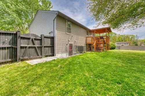 a house with a fence and a yard at MdPulse 2BR Upper Suite Peaceful Retreat Near DC in Waldorf