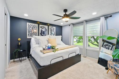 a bedroom with a bed with a ceiling fan at MdPulse 2BR Upper Suite Peaceful Retreat Near DC in Waldorf