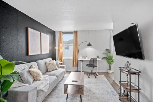 a living room with a couch and a table at Modern Stay Comfort-Free Parking in Cincinnati