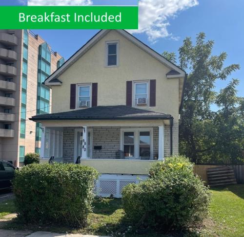 a house that has been remodeled with the words breakfast included at Exceptionally Close to the Falls Amazing Location & Complimentary Breakfast Delivered Daily to the Rental in Niagara Falls