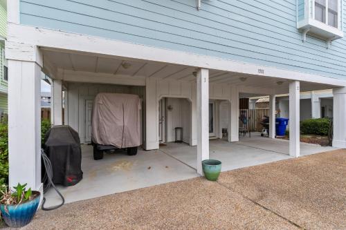 a large covered porch on a house at Steps to the Sand in Carolina Beach Sleeps 10 Villa in Carolina Beach