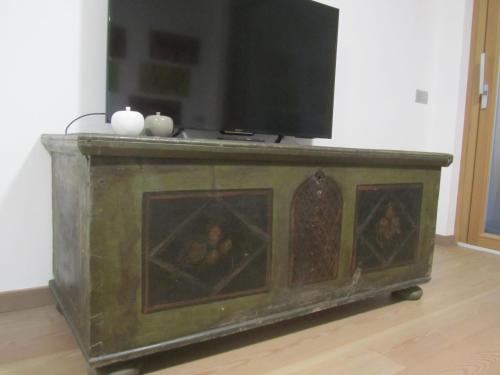 a television on top of a dresser in a room at NonSoloMele in Romallo