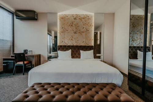 Postel nebo postele na pokoji v ubytování Highgarden Hotel