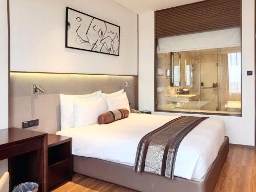 Postel nebo postele na pokoji v ubytování Xian heng Hotel