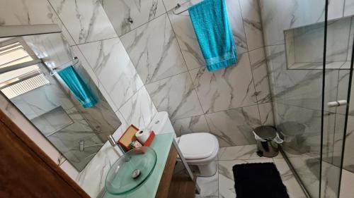 a bathroom with a shower and a toilet and a sink at - Apê perto do Alphaville - in Osasco