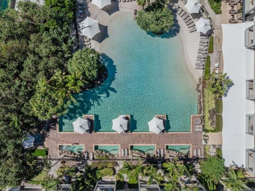 an aerial view of a pool at a resort at The Sand Resort Kingscliff - Holiday Management Co. in Kingscliff