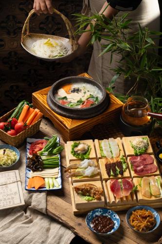 a table with many different types of food on it at 大理松云悬崖酒店 in Dali Ancient Town