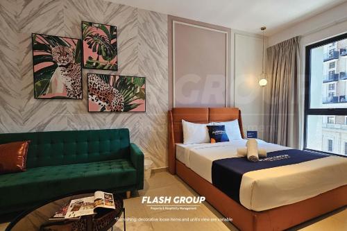 a hotel room with a bed and a green couch at Paxtonz Premium Suites Petaling Jaya in Petaling Jaya