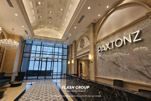 a lobby of a fashion store with a sign on the wall at Paxtonz Premium Suites Petaling Jaya in Petaling Jaya