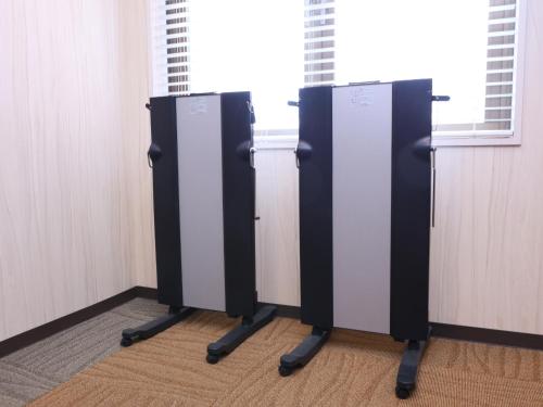 a row of public stalls in a room at Dormy Inn Sapporo Annex in Sapporo